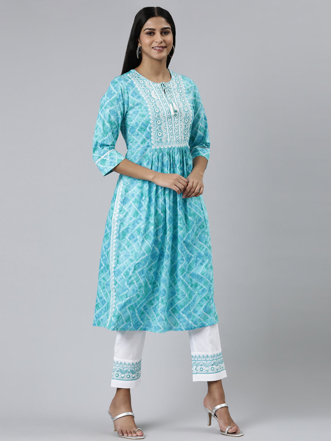 Neerus Green cotton printed kurta set with trouser and dupatta - back view